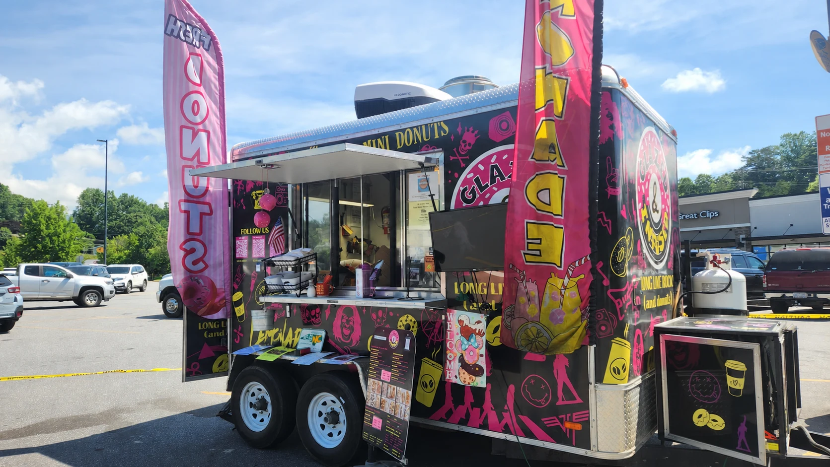 The Glazed and Infused donut trailer with its pink and yellow rock artwork